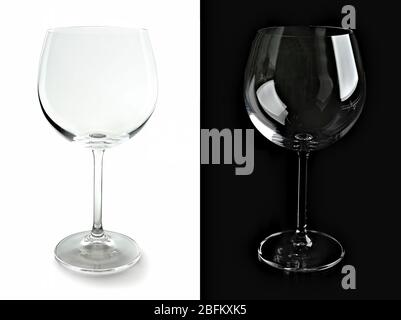 Deux verres à vin vides, isolés sur fond noir et blanc Banque D'Images