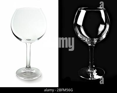 Deux verres à vin vides, isolés sur fond noir et blanc Banque D'Images