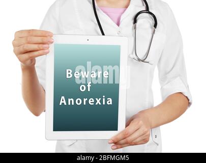 Médecin féminin avec tablette pc et texte récupération d'Anorexia à l'écran isolé sur blanc Banque D'Images