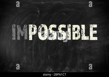 Mot impossible transformé en possible sur le tableau noir Banque D'Images