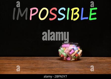 Mot impossible transformé en possible sur le tableau noir Banque D'Images