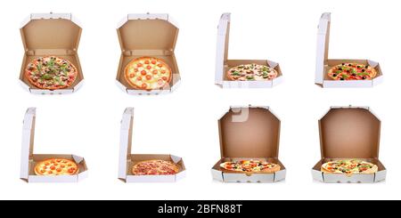 Ensemble de délicieuses pizzas dans des boîtes de livraison sur fond blanc. Banque D'Images