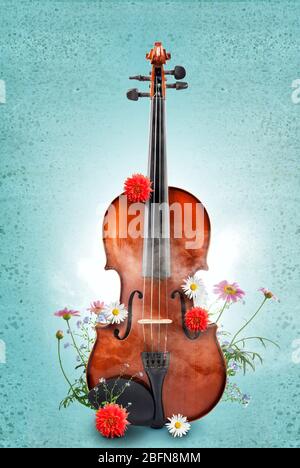 Violon classique avec fleurs sur fond de couleur. Concept de travail artistique créatif. Banque D'Images