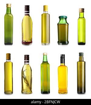 Bouteilles avec différentes huiles d'olive sur fond blanc Banque D'Images