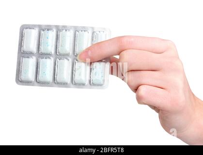 Blister avec 10 gommes à mâcher à la main isolé sur blanc Banque D'Images