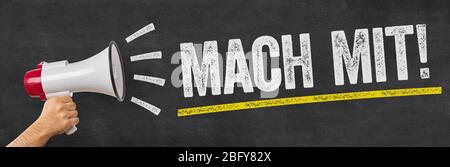 Un homme qui tient un mégaphone - se joindre à - Mach mit (allemand) Banque D'Images