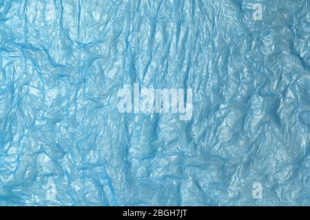 Fond en polyéthylène recyclable bleu. ECO, zéro déchet, alternative au concept plastique. Pose plate. Horizontal. Gros plan. Banque D'Images