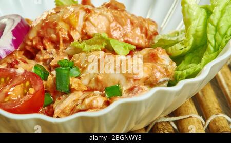 ASA Tibs - poisson de sauté éthiopien, la morue est marinée dans le jus de citron vert avant de frire humide dans les épices et les tomates. Banque D'Images