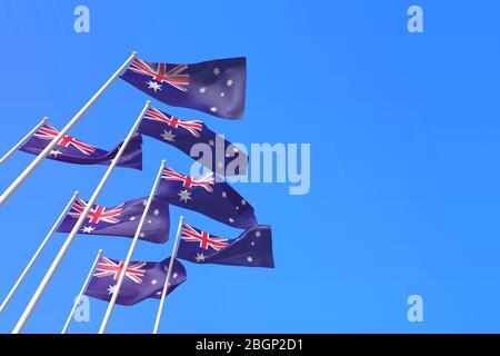 L'Australie marque des drapeaux qui agitant dans le vent contre un ciel bleu. Rendu 3D Banque D'Images