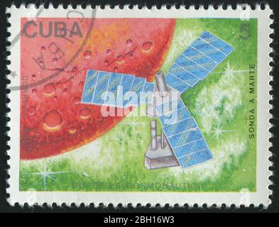 CUBA - VERS 1988 : cachet imprimé par Cuba, montre satellite et planète, vers 1988. Banque D'Images