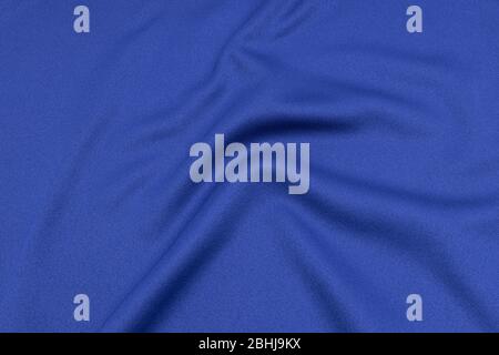 Vêtements de sport tissu texture fond. Vue du dessus de la surface textile en tissu. Maillot de football bleu avec CopySpace. Banque D'Images