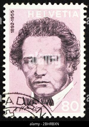 SUISSE - VERS 1972 : un cachet imprimé en Suisse montre Arthur Honegger, compositeur, vers 1972 Banque D'Images