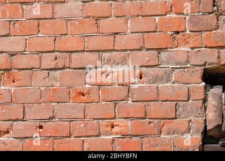 Mur de brique avec des traces de balles Banque D'Images