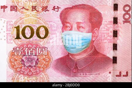 Masque chirurgical de Mao TSE-tung sur le gros plan des billets de banque chinois Yuan. Concept commercial de pandémie de virus Covid 19-NCP en Chine. Coronavirus Covid-19 Banque D'Images