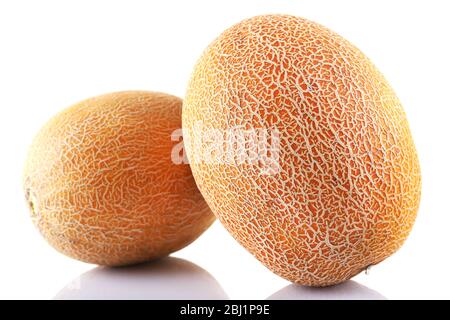 Melons frais isolés sur blanc Banque D'Images