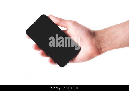 Smartphone moderne et simple tenu à la main, écran noir vide vierge. Objet isolé sur fond blanc, découpés. Affichage de quelque chose sur un téléphone mobile Banque D'Images