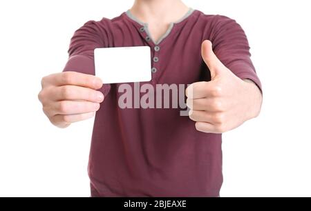 Jeune homme avec carte vierge sur fond blanc, gros plan Banque D'Images