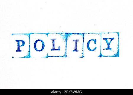 Encre bleue de tampon en caoutchouc dans la politique de mot sur fond de livre blanc Banque D'Images