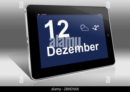 Un ordinateur tablette affiche un calendrier en langue allemande avec la date 12 décembre | Ein Tablet-Computer zeigt das Datum 12. Dezember Banque D'Images