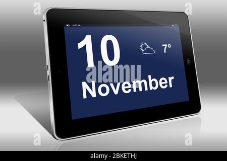 Un ordinateur tablette affiche un calendrier en langue allemande avec la date 10 novembre | Ein Tablet-Computer zeigt das Datum 10. Novembre Banque D'Images