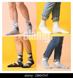 Jambes mâles dans différentes chaussettes sur fond coloré Banque D'Images