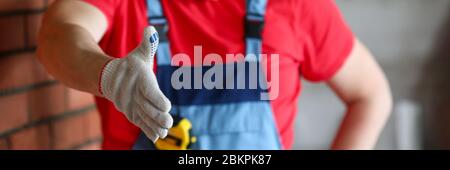 Homme en gants et en gilets Banque D'Images
