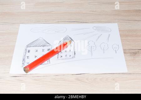 Dessin d'enfant avec un crayon simple sur une feuille de papier blanche Banque D'Images