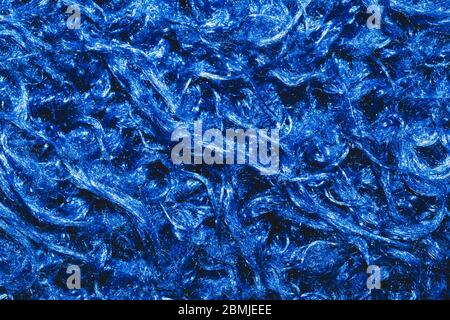 Texture en tissu doux. Tissu bleu avec fibres bouchées. Arrière-plan en laine gros plan Banque D'Images