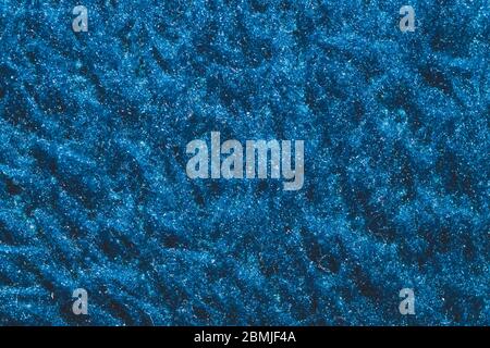 Texture en tissu doux. Tissu bleu avec fibres bouchées. Arrière-plan en laine gros plan Banque D'Images