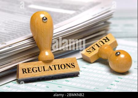 Règles et règlements marqués sur timbre en caoutchouc Banque D'Images