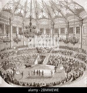 Monuments de Paris : vue d'un spectacle du cirque avec des couturiers de chevaux au cirque Napoléon (cirque-Napoléon puis cirque d'hiver) a Paris, 1855 Banque D'Images