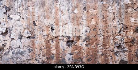 Détail panoramique d'un vieux mur de maison en ruine Banque D'Images