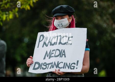 Photos d'un manifestant à Glasgow Green, contre le blocage pandémique du coronavirus. Banque D'Images