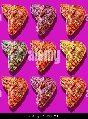 Neuf T-Bones steaks avec différentes marinades garnie avec red hot chili cayenne en rangées sur un fond rose magenta vif Banque D'Images