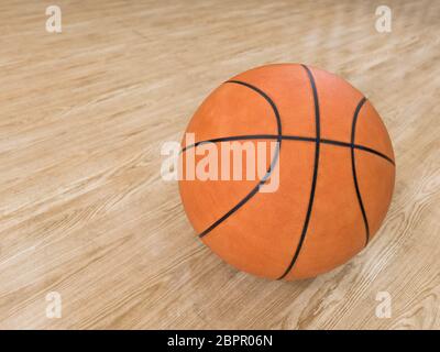 Basket Ball avec plancher en bois isolé sur noir avec copy-space Banque D'Images