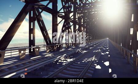 Pont ferroviaire sur une journée ensoleillée contre le ciel bleu et la mer. Banque D'Images
