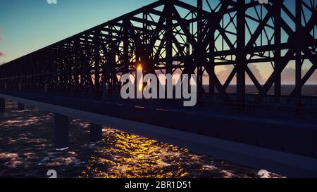 Pont ferroviaire sur un coucher de soleil contre le ciel bleu et la mer. Banque D'Images
