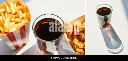 collage de poulet frits savoureux, frites et soda en verre sur table blanche au soleil Banque D'Images