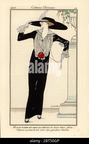 Femme en robe noire à gaine satinée, chapeau en soie noire. Fourreau de satin noir sur interieur de linon blanc plisse, chapeau en peau de fille noire garnie avec niture blanche. Pochoeur de couleur main (pochoir) gravé après une illustration de Xavier Gose de Tommaso Antonginis Journal des Dames et des modes, aux bureaux du Journal des Dames, Paris, 1912. Banque D'Images