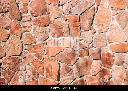 Revêtement de texture vintage, pavés rouges pour le fond et la texture, vieux mur de grès calcaire Banque D'Images