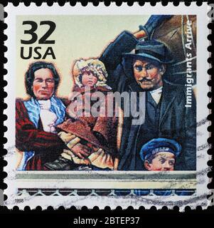 Les immigrants arrivant à Ellis Island sur le timbre américain Banque D'Images