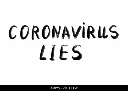CORONAVIRUS EST LE texte écrit à la main - lettrage isolé sur blanc. Coronovirus COVID 19 concept Banque D'Images