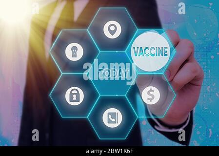 Texte d'écriture vaccin. Préparation photographique conceptuelle de micro-organismes tués ou vivants atténués Banque D'Images