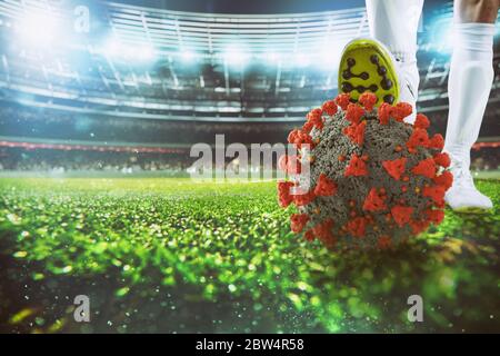 Joueur de football avec virus ball sous la chaussure de football au stade Banque D'Images