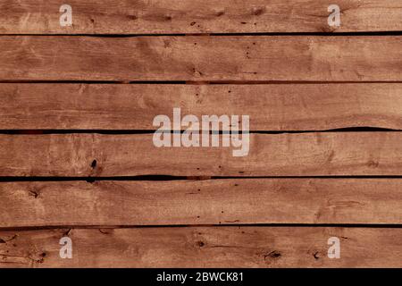 Aménagement horizontal de vieilles planches dans un bâtiment de ferme en bois. Banque D'Images