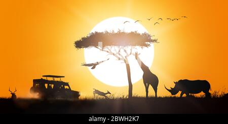 Scène de silhouette de coucher de soleil de safari africain avec véhicule de jeu et animaux sauvages Banque D'Images