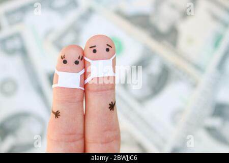 Doigts art de couple avec masque de visage sur fond d'argent. Banque D'Images