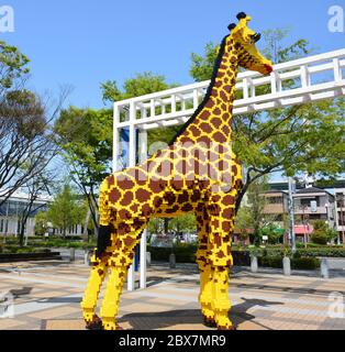 Girafe de dessin animé en briques au Japon Banque D'Images