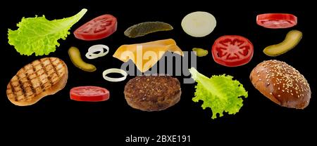 Ingrédients hamburger volants isolés sur fond noir. Concept de la lévitation alimentaire. Produits de restauration rapide Banque D'Images