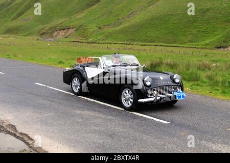 MOFFAT, ÉCOSSE - 29 JUIN 2019 : Triumph TR3 UNE voiture de sport Roadster dans un rallye automobile classique en route vers la ville de Moffat, Dumfries et Galloway Banque D'Images